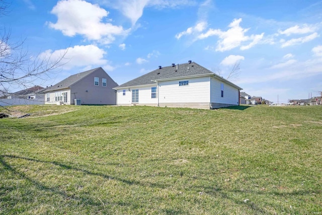 back of property featuring a lawn