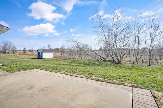 view of yard featuring a storage shed, an outbuilding, and a patio