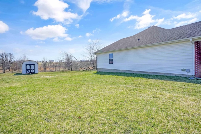 view of yard featuring a storage shed and an outbuilding