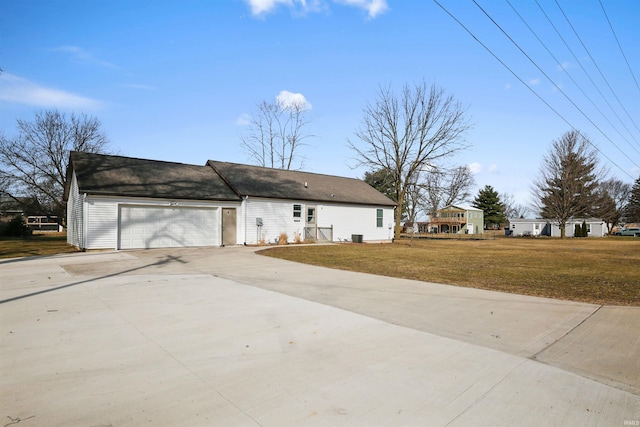 view of front facade with an attached garage, driveway, and a front yard