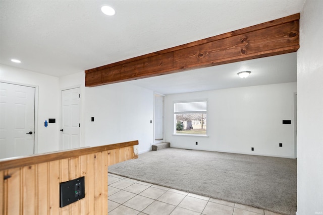 interior space with light carpet, light tile patterned floors, and recessed lighting