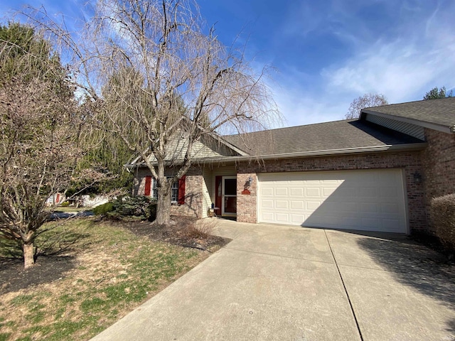 view of front of property featuring brick siding, concrete driveway, a garage, and roof with shingles