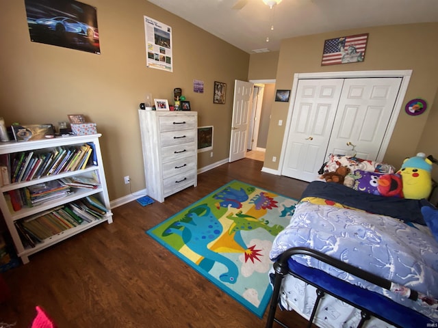 bedroom with a closet, ceiling fan, baseboards, and wood finished floors