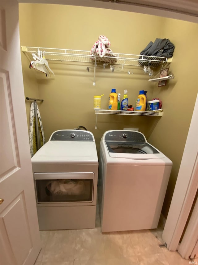 washroom featuring washer and dryer and laundry area