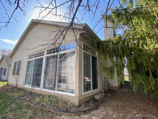 view of side of property featuring a chimney