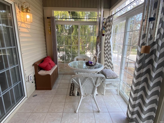 unfurnished sunroom with a wealth of natural light