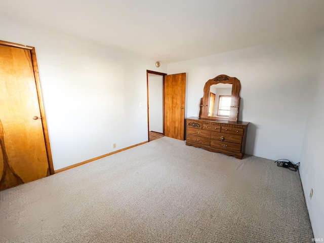 unfurnished bedroom featuring carpet