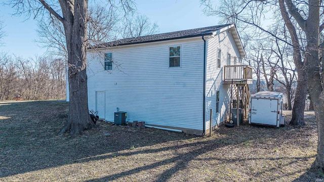 view of property exterior with central AC unit