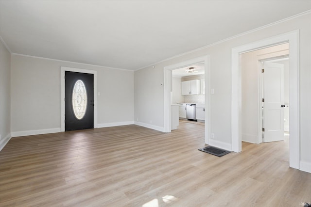 unfurnished living room with visible vents, baseboards, light wood-style flooring, and crown molding