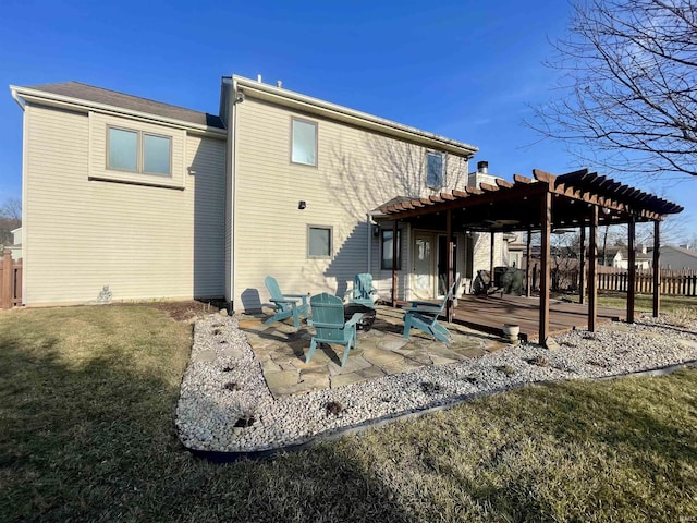 rear view of house with fence, a patio area, a pergola, and a lawn