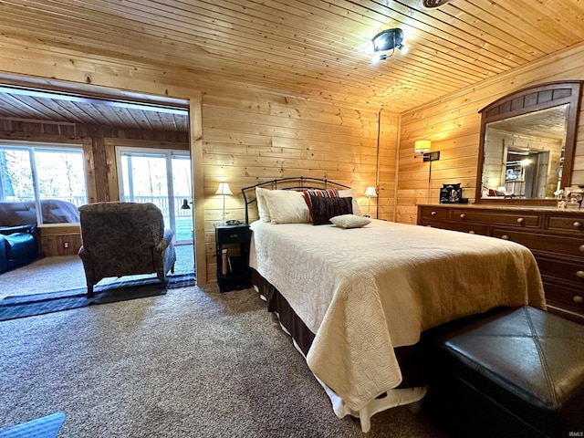 bedroom featuring wooden ceiling, wooden walls, carpet flooring, and access to exterior