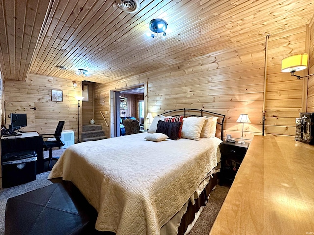 bedroom featuring carpet flooring, wood walls, wooden ceiling, and visible vents