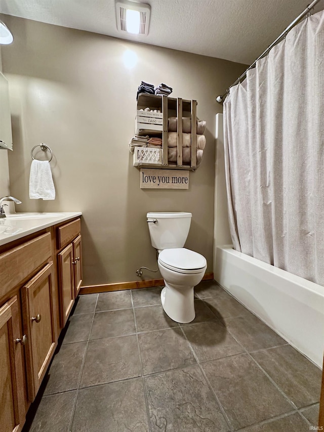 bathroom with vanity, visible vents, a textured ceiling, tile patterned floors, and toilet