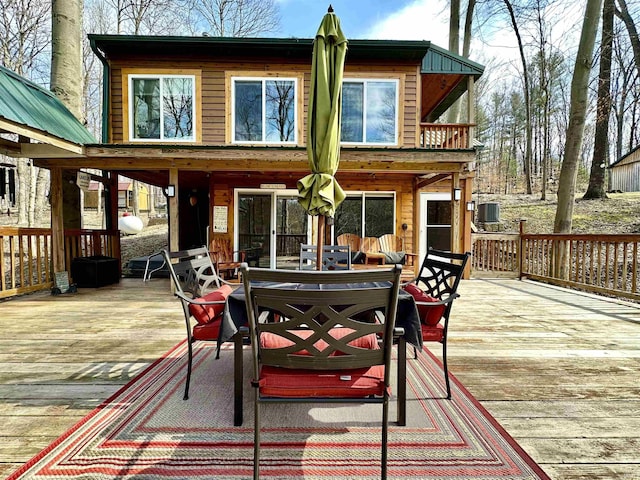 back of house with a wooden deck