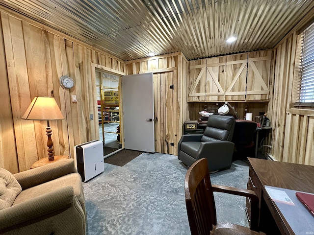 living area featuring wood walls and wooden ceiling