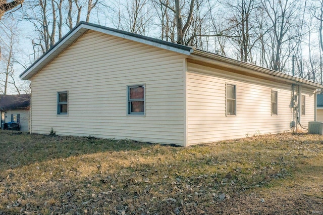 view of side of property featuring central AC