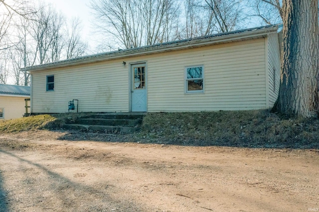 rear view of property with entry steps