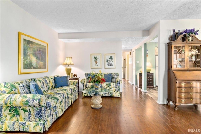 living room with hardwood / wood-style flooring and a textured ceiling