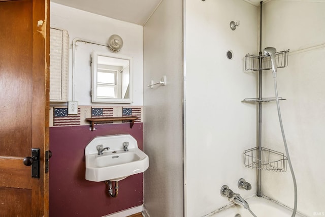 full bath with bathing tub / shower combination and a sink