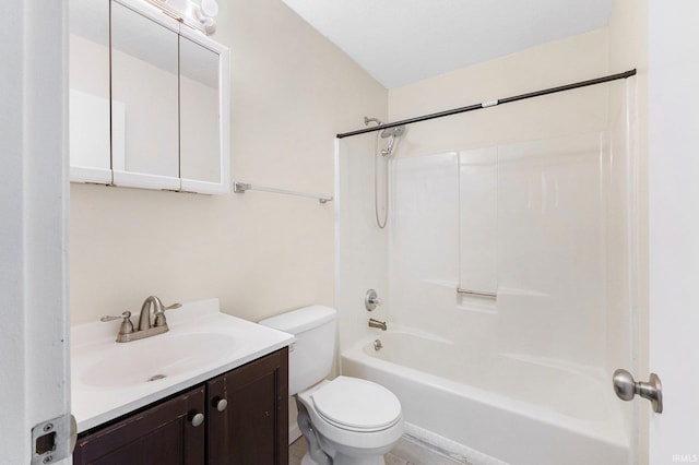 bathroom with shower / bath combination, toilet, and vanity