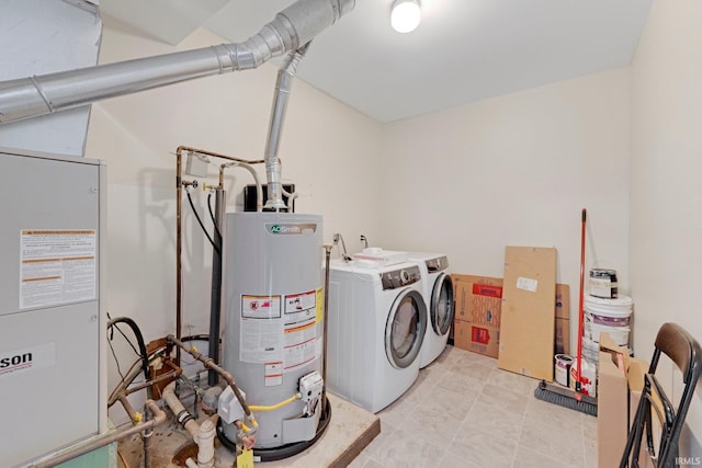 laundry area with washing machine and dryer and gas water heater