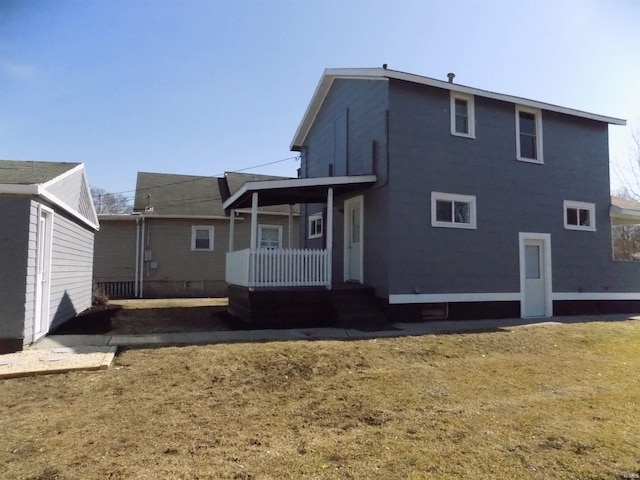 rear view of property featuring a porch