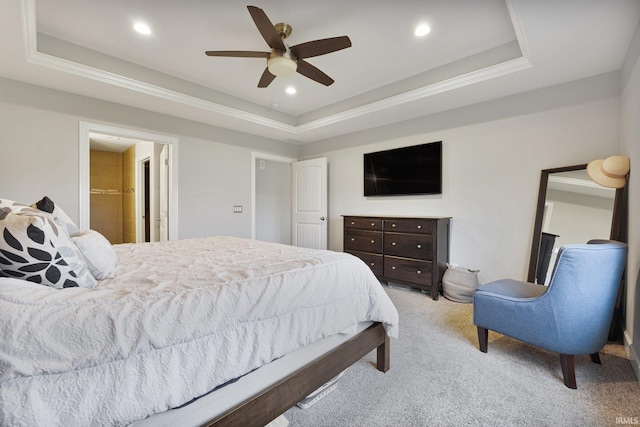 bedroom with a ceiling fan, a raised ceiling, recessed lighting, and light colored carpet