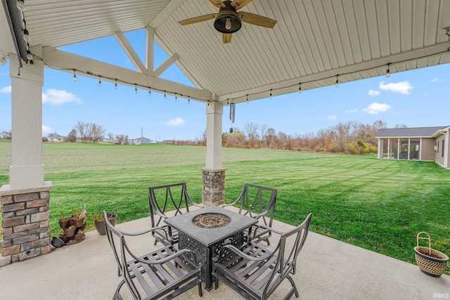 view of patio / terrace featuring a fire pit and a ceiling fan