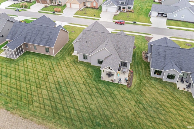 birds eye view of property with a residential view