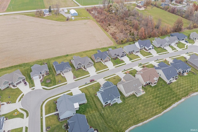 bird's eye view featuring a residential view and a water view