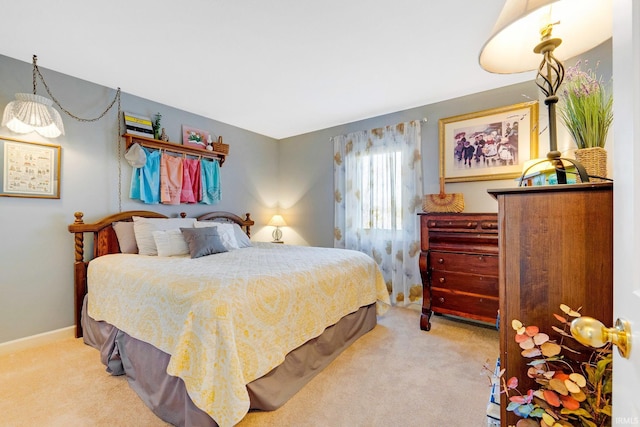 bedroom with baseboards and carpet flooring