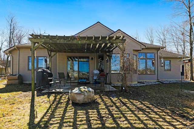 back of house with a pergola and a patio