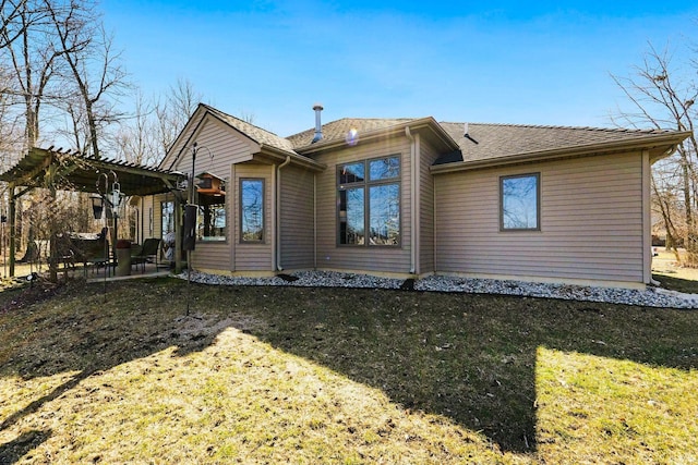 back of property featuring a patio, a yard, and a pergola