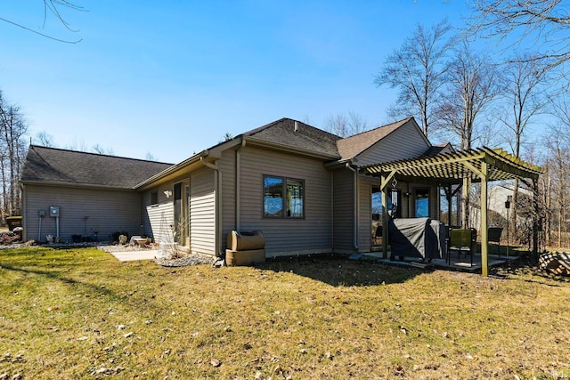 rear view of property featuring a patio area, a lawn, a pergola, and a shingled roof