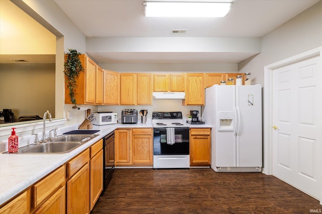 kitchen featuring electric range, visible vents, a sink, under cabinet range hood, and white fridge with ice dispenser