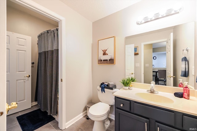 full bathroom featuring tile patterned floors, toilet, a shower with shower curtain, baseboards, and vanity