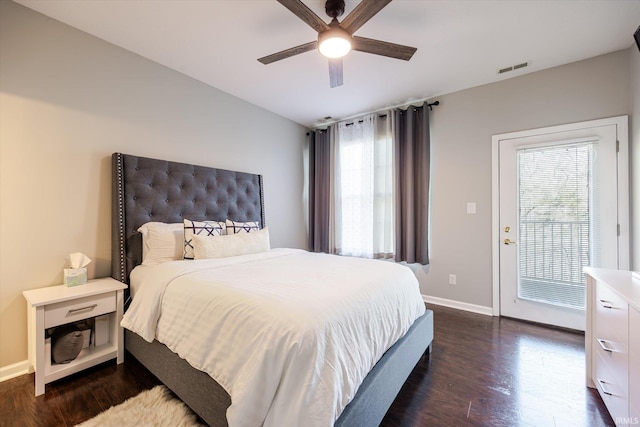 bedroom with dark wood finished floors, visible vents, a ceiling fan, and baseboards