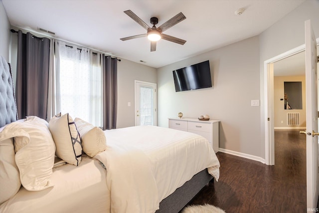 bedroom featuring visible vents, ceiling fan, baseboards, and dark wood-style flooring