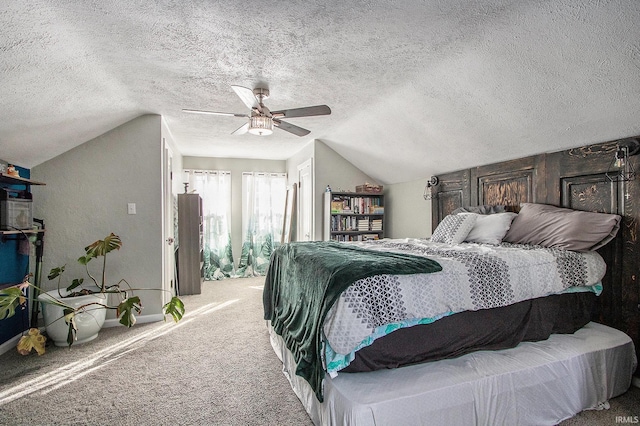 carpeted bedroom featuring lofted ceiling, a ceiling fan, baseboards, and a textured ceiling