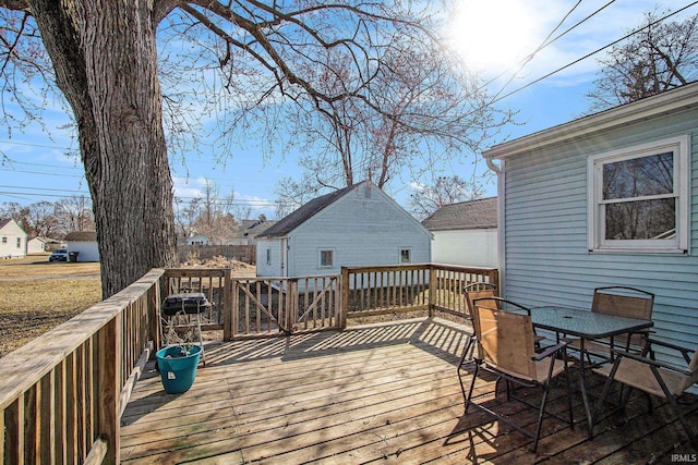 wooden deck featuring outdoor dining space and fence