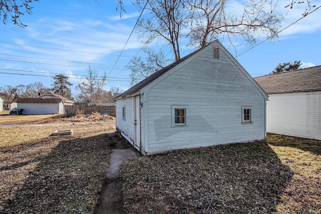 view of home's exterior with fence