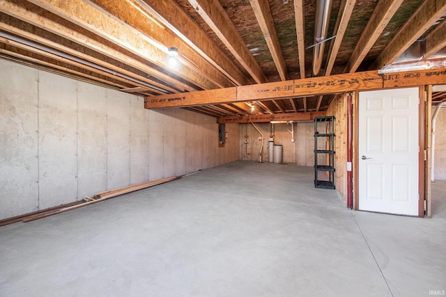 unfinished basement featuring electric panel