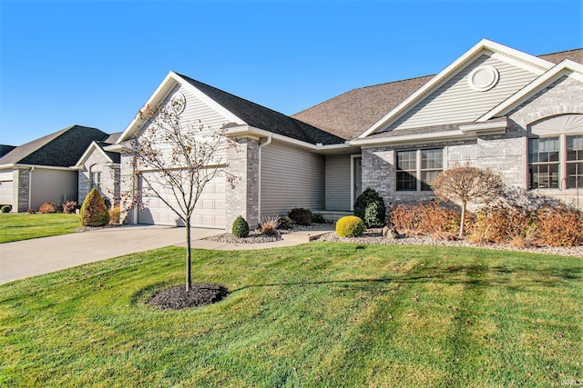 ranch-style home with a front yard, driveway, roof with shingles, an attached garage, and brick siding