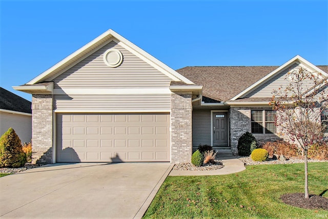 ranch-style house with a front yard, roof with shingles, concrete driveway, a garage, and brick siding