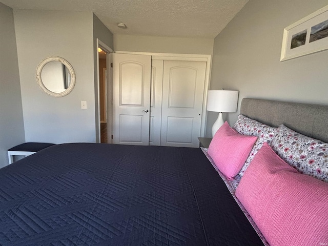 unfurnished bedroom with a closet and a textured ceiling