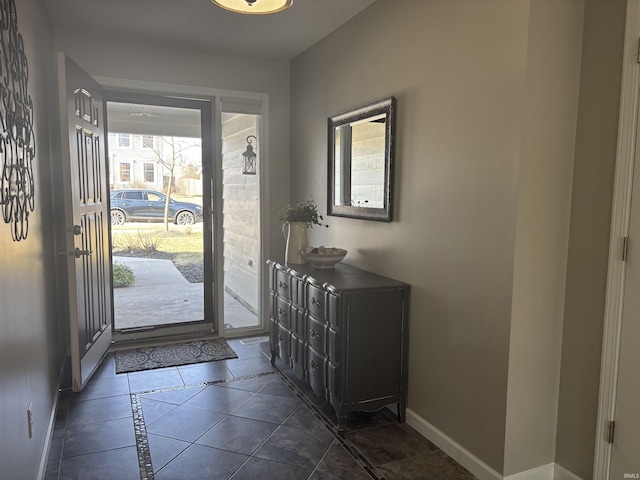 foyer entrance with baseboards