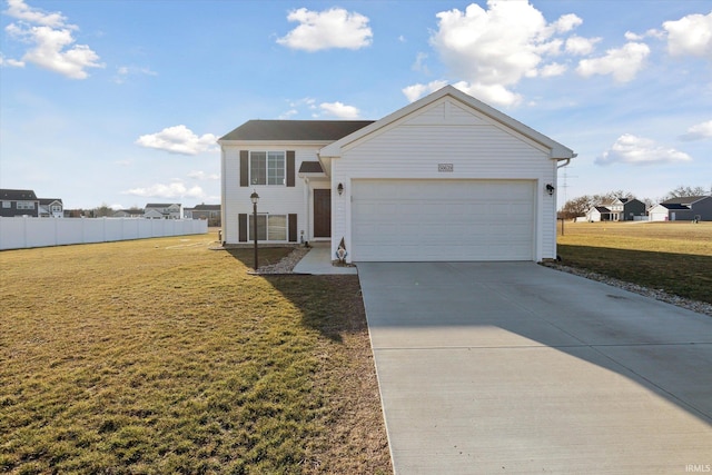 view of front facade featuring a garage, driveway, a front lawn, and fence