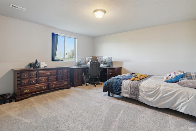 bedroom featuring visible vents and carpet flooring