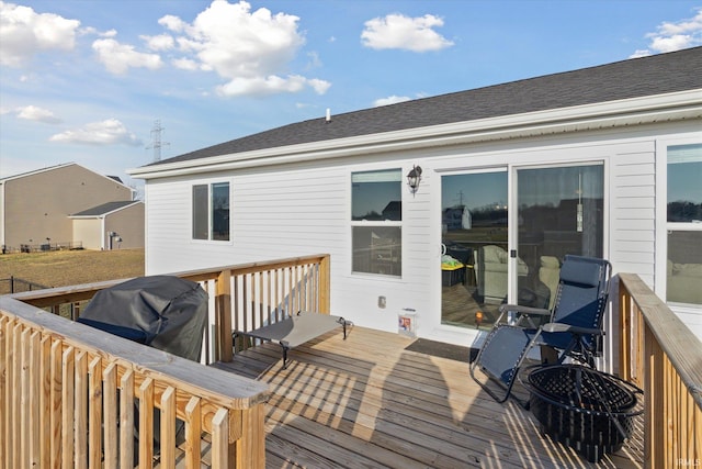 wooden deck with area for grilling