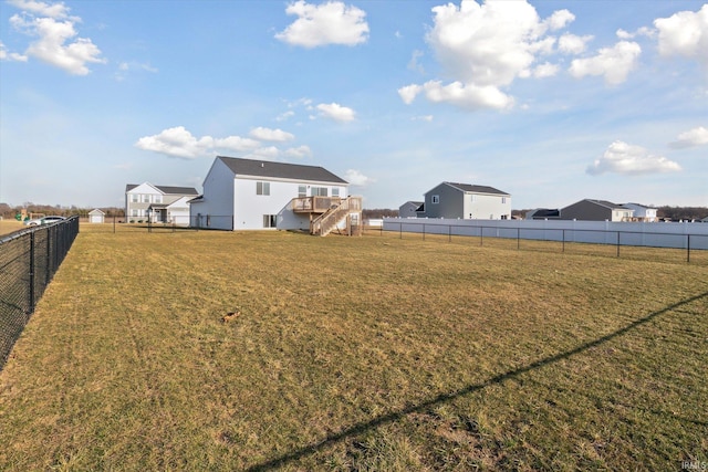 view of yard featuring stairway and a fenced backyard